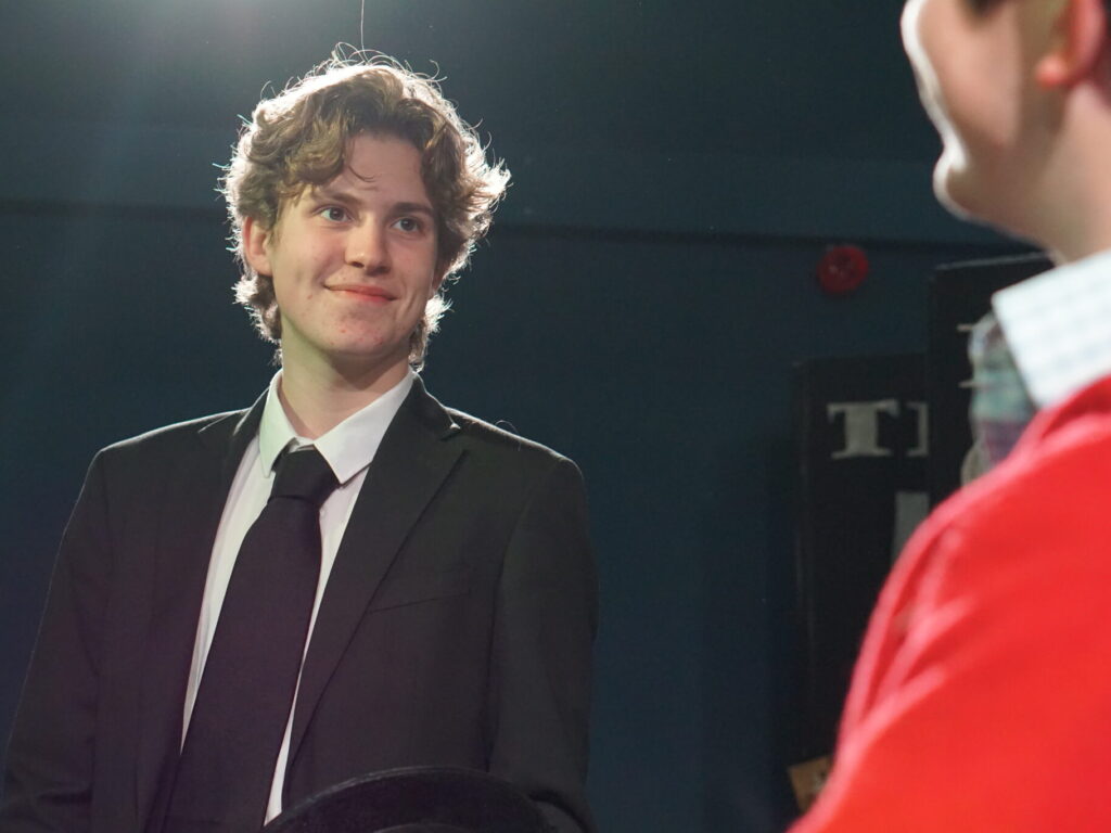 student wearing a suit