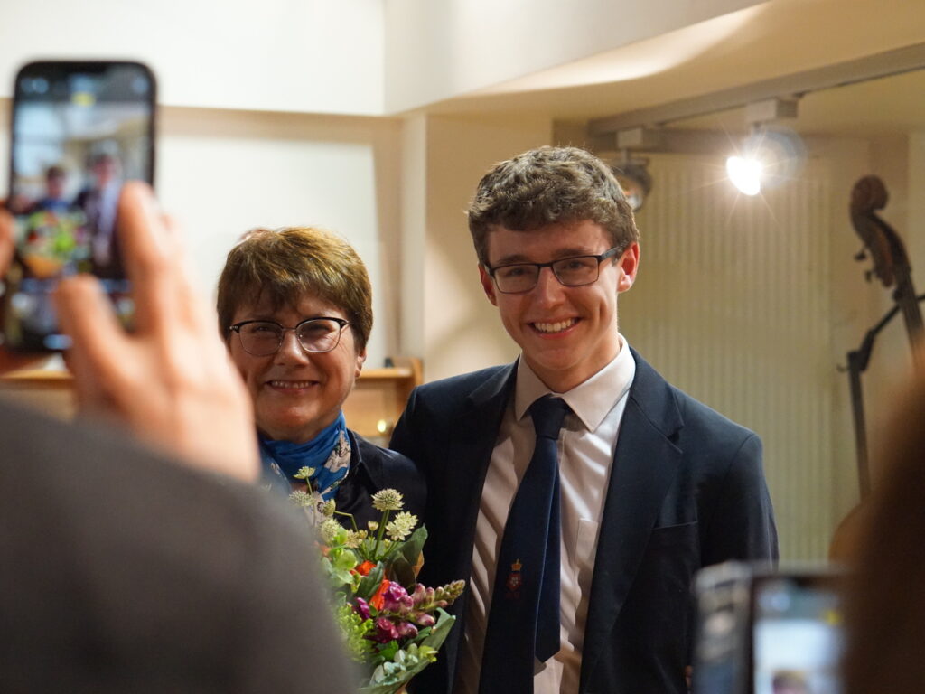 boy and woman taking a photo