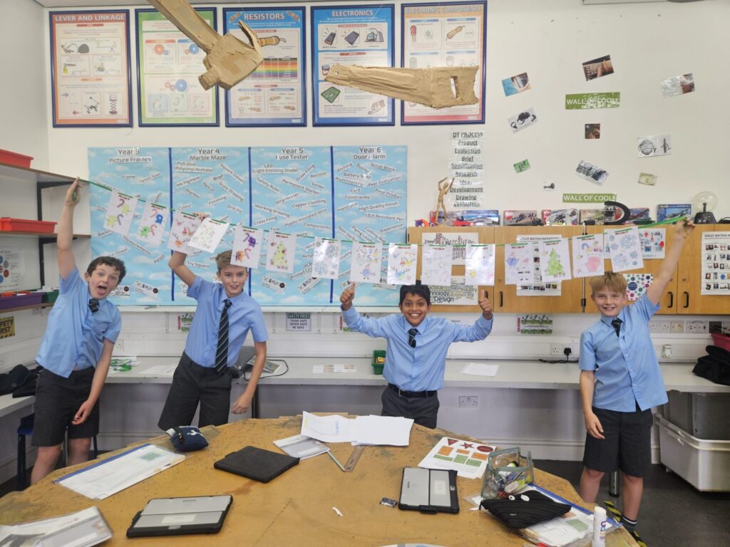 students holding up their colouring