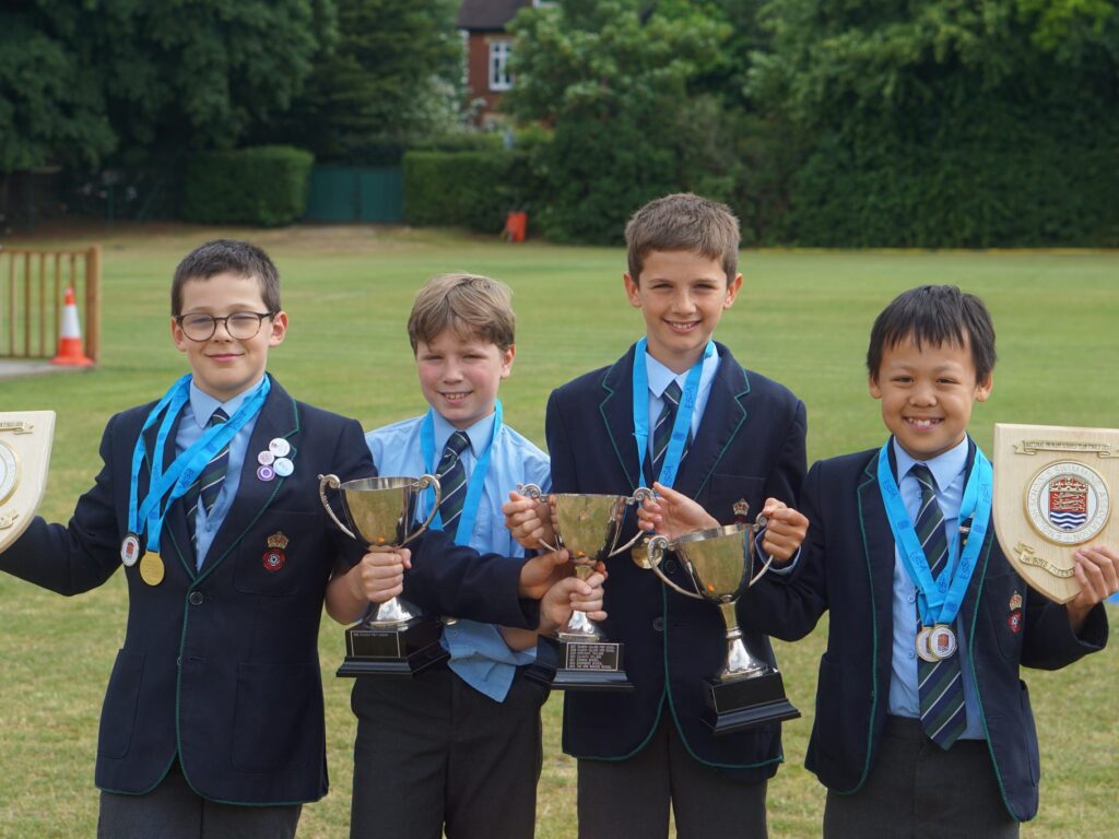 students holding awards