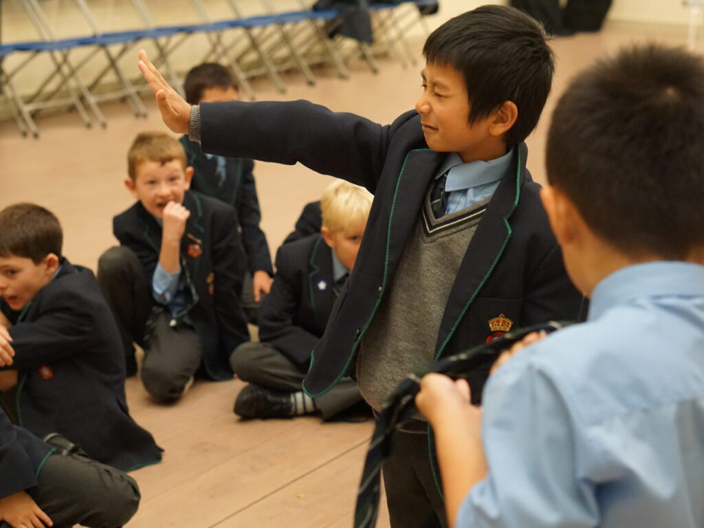 student holding out his hand