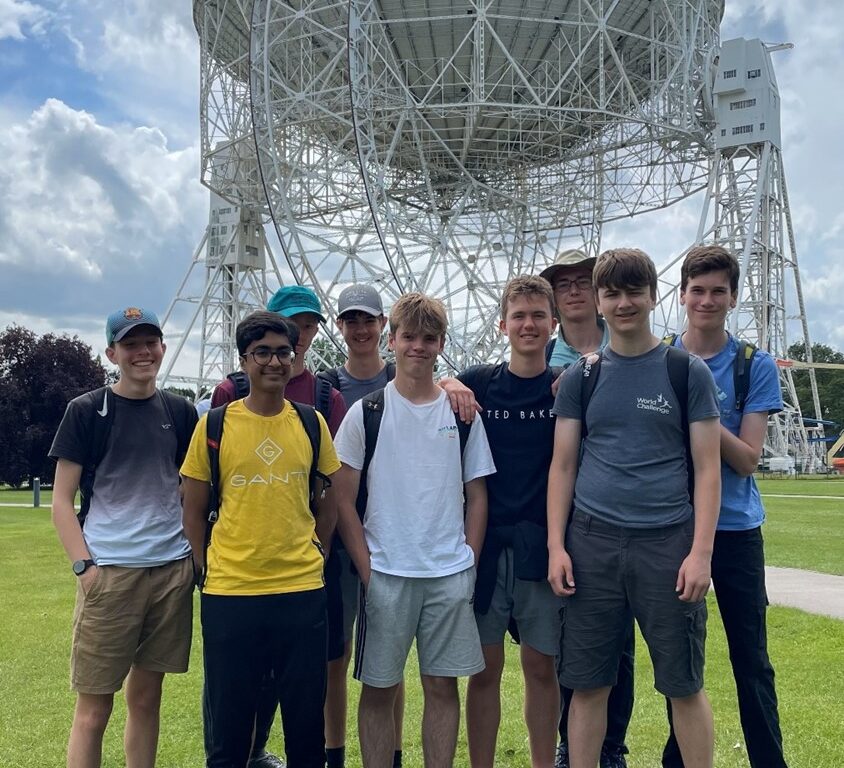 students by a tall building