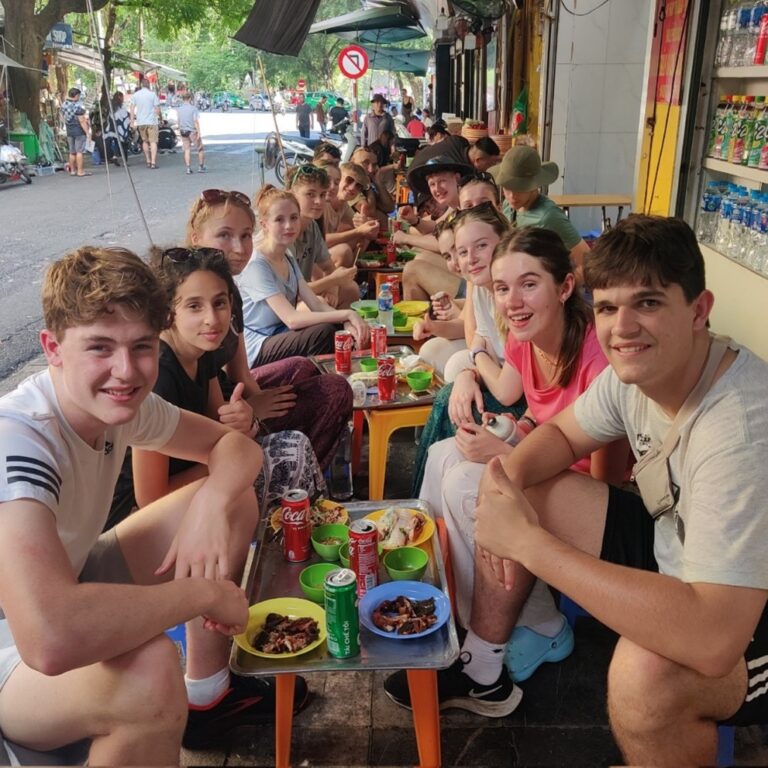 students enjoying street food