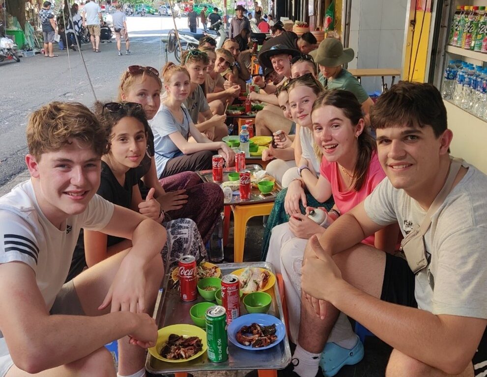 students enjoying street food