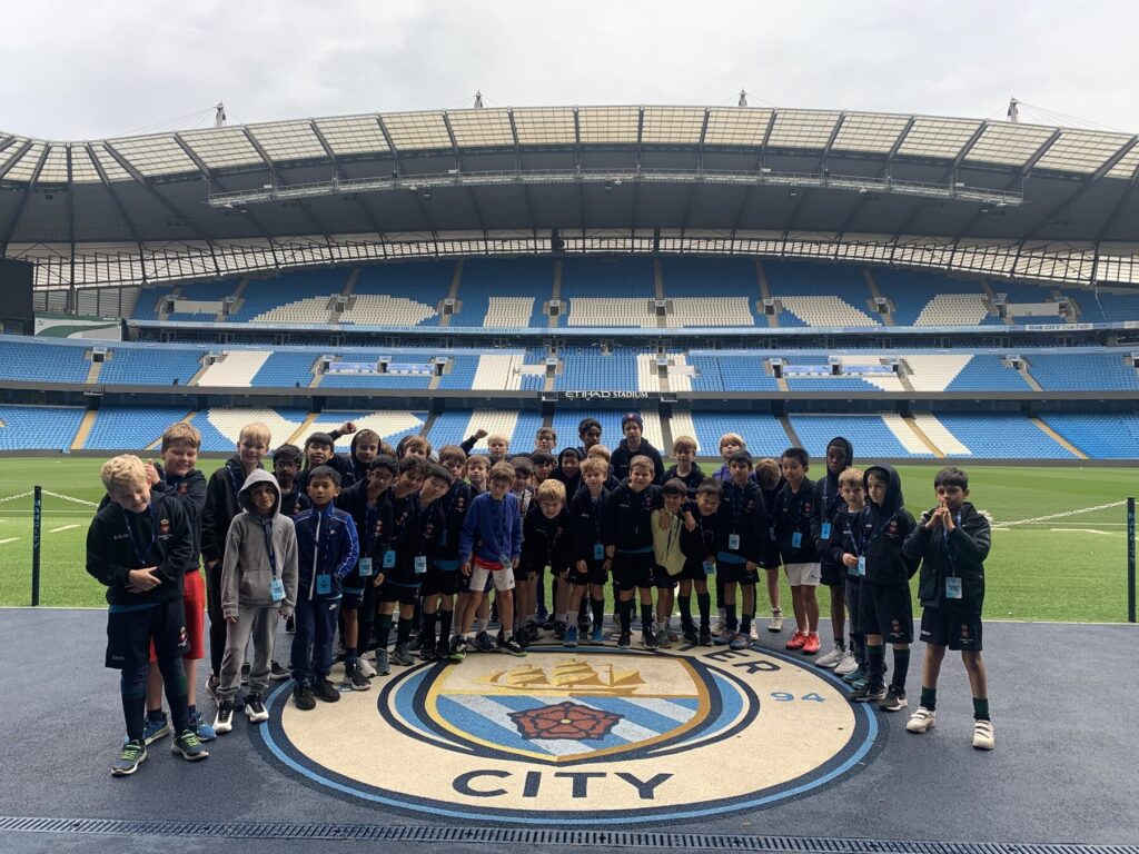 students at a football stadium